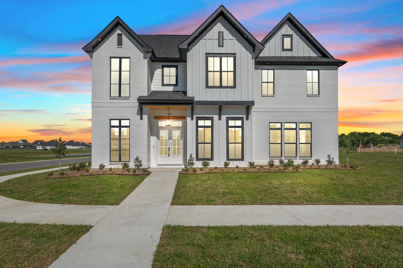 310 Alexander Palm Avenue custom home in Broussard, Louisiana, at twilight
