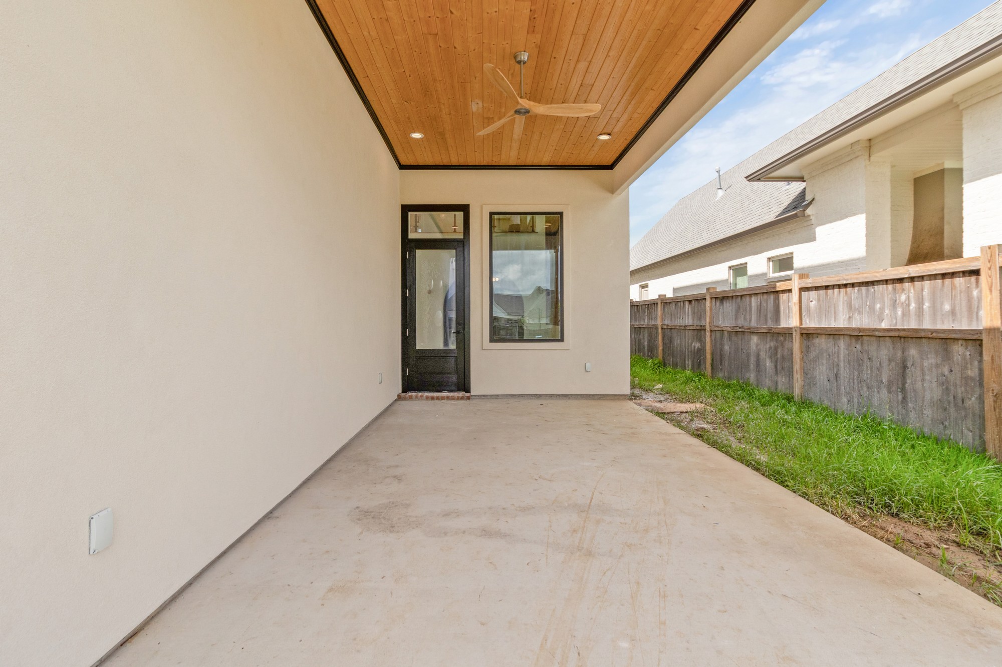 Covered patio with a wood ceiling at 221 Gunter Grass